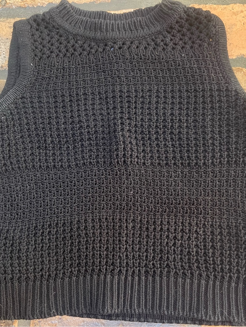 black sweater vest